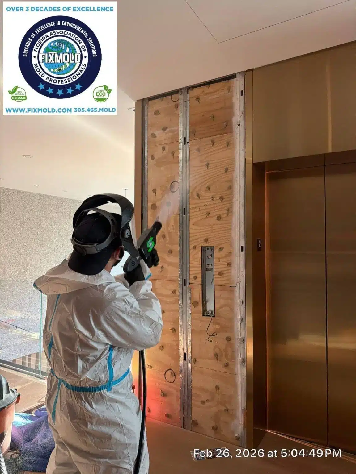 FixMold Professional performing mold inspection inside a commercial building using advanced detection equipment for hidden mold.
